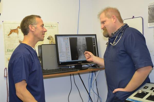 Dr. Wikert and Dr. Keen reading a digital x-ray