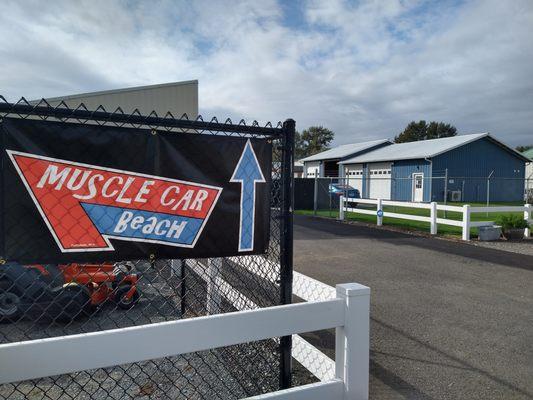 Drive through Pete's Auto Repair parking lot to find our building.