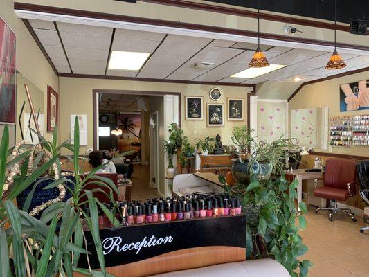 Reception desk and one more table for nails and entrance to the chairs for the pedicures