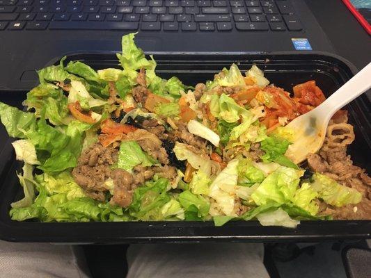 Beef bowl to-go. Fried rice, kimchi, beef and lettuce.