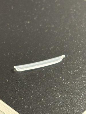 The piece of plastic i found in my chicken burrito.