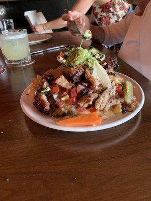 Carnitas Nachos Libres on the happy hour , black beans, carnitas, guacamole , tomato's , onions. To die for. Definitely before seven.