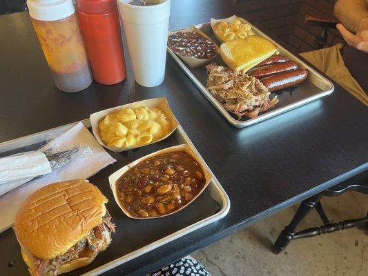 Brisket sandwich, hot links, pulled pork, beans, macaroni and cheese