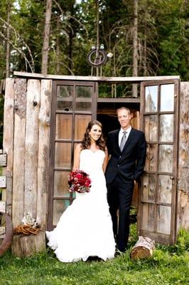 Wedding couple in front of chicken coup