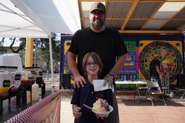 Father and son enjoying Tejano Raspas at Latina Market 11/9/24.