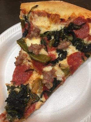 Green Hill Cafe pizza with sausage, peppers and spinach.