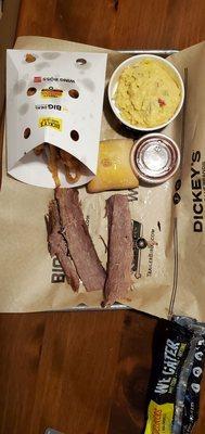 $14 one meat plate: room temperature, sliced lean brisket, potato salad, & onion tanglers.