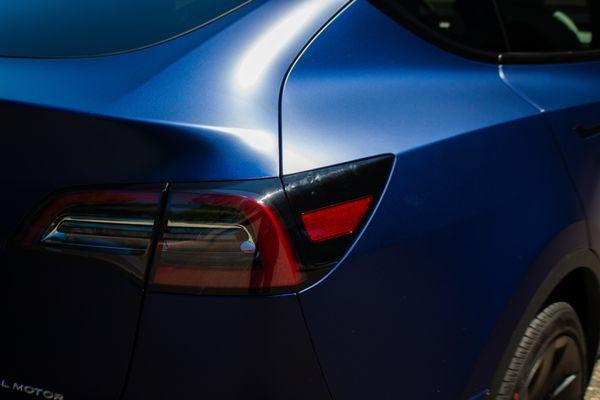 Paint protection film installation on Tesla Model Y. Tail lights