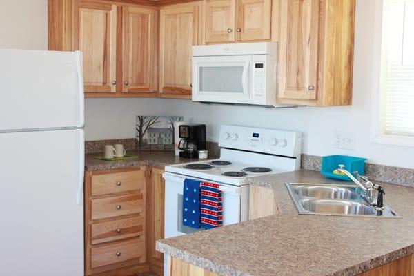 Kitchens in the 1 & 2 bedroom units feature all of the appliances and dishes you'll need during your stay.