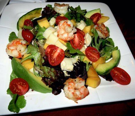 Tropicale salad with shrimp, mango, tomato, avocado over mixed greens