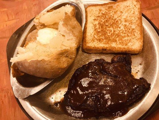 Steak, baked potato and Texas toasted bread