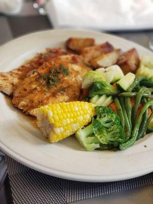 Grilled lemon chicken with roasted potatoes.