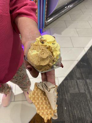 To ice cream scoops in a cup