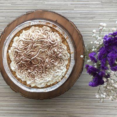 Banoffee - From scratch shortbread crust filled with toffee sauce and bananas. Topped with a homemade whipped cream.