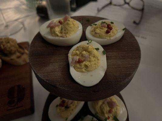 NINES DEVILED EGGS(
 Virginia ham, black truffle, smoked salt,
 pink peppercorn