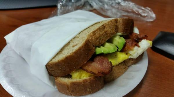 $4 baby! Egg sandwich with bacon cheese avocado on toasted wheat bread.