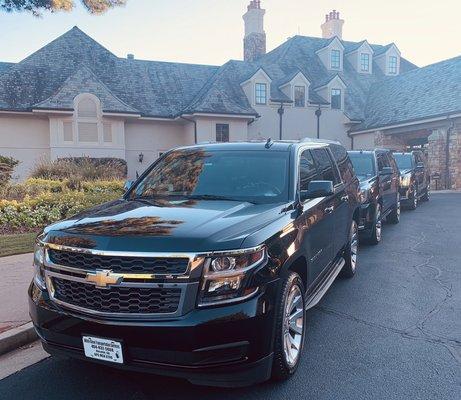 Sleek black SUVs at ATL golf venue - transporting you to wonderful places in style.