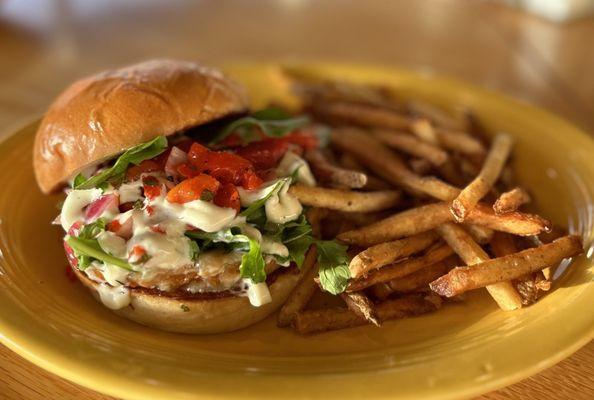 House made veggie burger - sweet potato, chickpea, chipotle - with arugula, herb aioli and roasted red pepper salsa on brioche with fries.