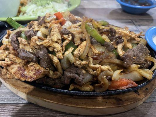 Combo fajitas (steak, chicken & shrimp).