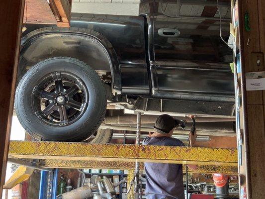 Muffler guy installing my new stock muffler