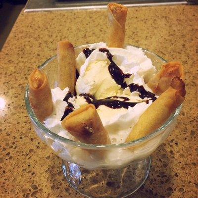 Banana Blanket Sundae - Fresh banana inside egg roll shell with premium vanilla ice cream top with fudge and whipped cream.