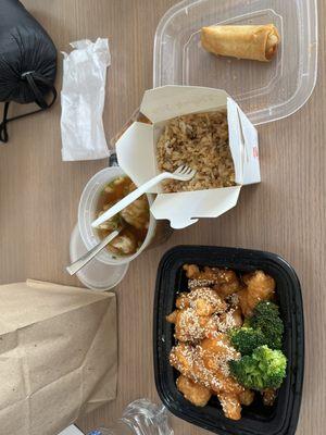 Sesame chicken, fried rice, egg roll, and wonton soup.