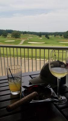 Taking a break from the heat with Drinks and a cigar at the course here.