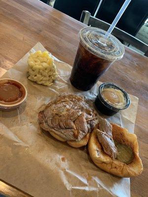 Pulled pork sandwich meal with Mac &cheese and banana pudding.