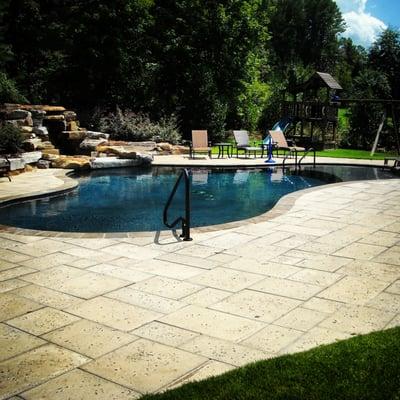 Custom waterfall and Gunite Pool with a Layout area.