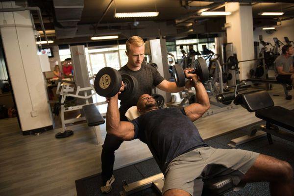 Robbie spotting a client on the Incline press.