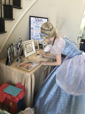 Cinderella has to sign every guest and autograph book!