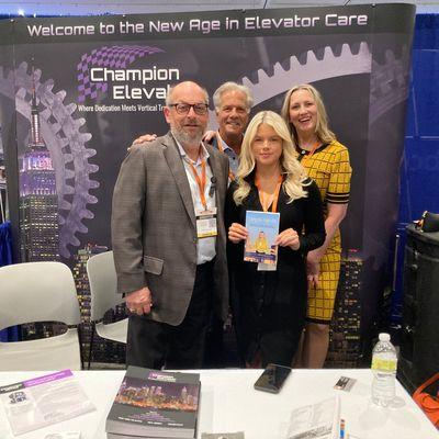 The Folson Group's, Tina Larsson stops by Champion Elevators's booth at the Coop and Condo Expo to talk Housing Cooperatives