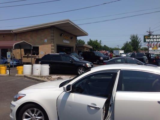 Washed car with Store front in the background