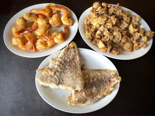 One pound each of fried shrimp, fried oysters, and broiled drum. All fresh, delicious Gulf Coast seafood.