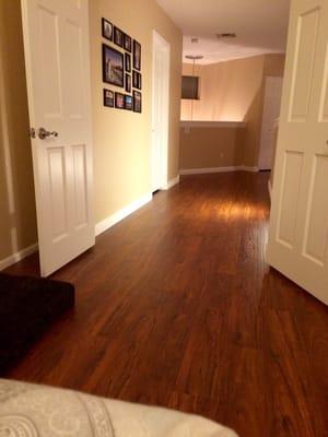 New Brazilian Cherry Wood Laminate in our upstairs bedroom and hallway