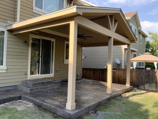 Gable style roof over decorative concrete patio