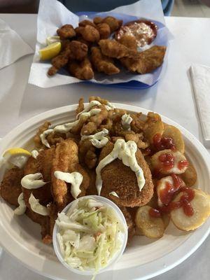 Scallops and Shrimp and Seafood Combo plater. Fried Flounder, Shrimp, crab cake with fish chips and coleslaw