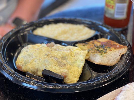 Crawfish Omelette with Grits and French Bread