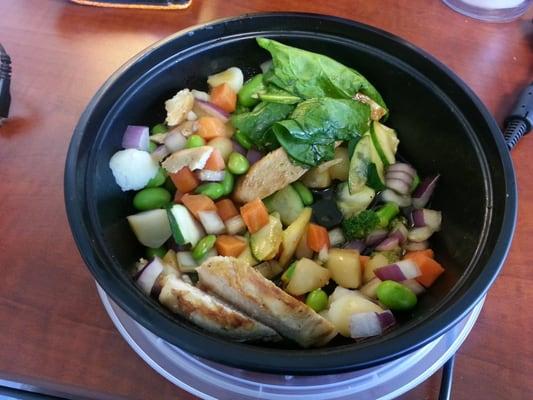 Bowl with chicken, edamame, spinach, broccoli and squash.