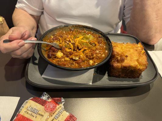 Big bowl of chili with jalapeño cornbread