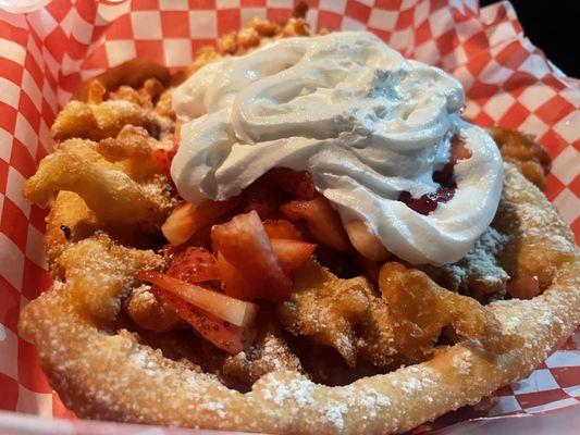 Regular funnel cake with strawberries and whipped cream