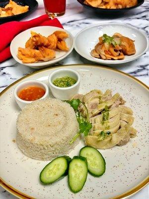 Hainan Chicken Rice. Experience the authentic flavors of this classic dish that will transport your taste buds to the streets of Singapore