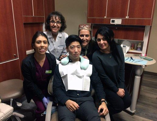 Dr. Abadan, the caring staff, and me before my new crown!