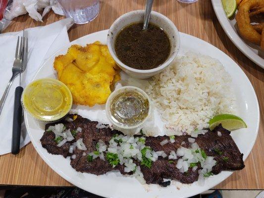 Skirt steak with rice & beans and tostones (fried green plantain) yummy!