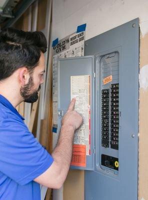 Tech checking the electrical panel