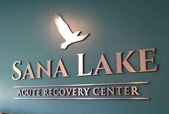 The Sana Lake Recovery logo in the lobby of the addiction treatment facility near St. Louis, MO.