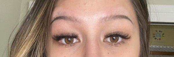 Uneven lash job, AFTER, initial visit: went to get gap fixed, woman lazily applied another lash on top of it.