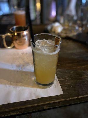 Peach Whiskey Sour with cinnamon stick