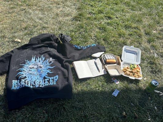 Eating at the grassy area by the food trucks. Great afternoon stop.