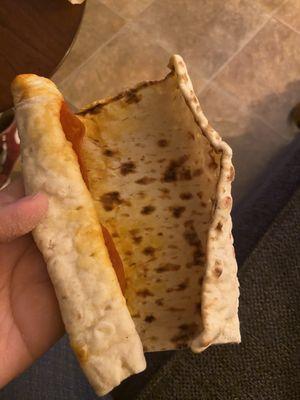 Just a piece of flatbread with three pepperonis in it.